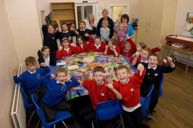 Children at the Happy Shack breakfast and after school club, in East Boldon, celebrate a good report from education inspectors in 2011.