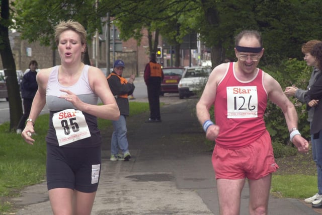 Two walkers battle it out right to the finish line at Hillsborough Park in 2000