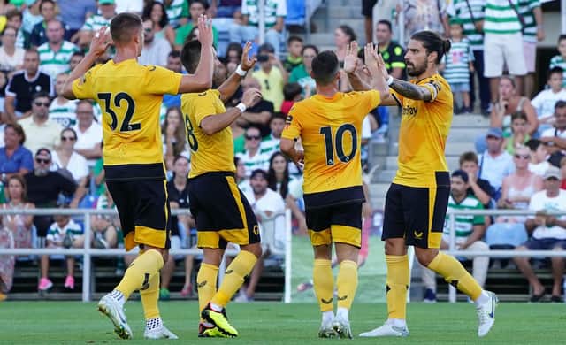 SPOT ON: Ruben Neves, right, celebrates with his Wolves team mates after firing his side in front through a first-half penalty in Saturday evening's pre-season friendly against Sporting Lisbon in Faro. Photo by Gualter Fatia/Getty Images.