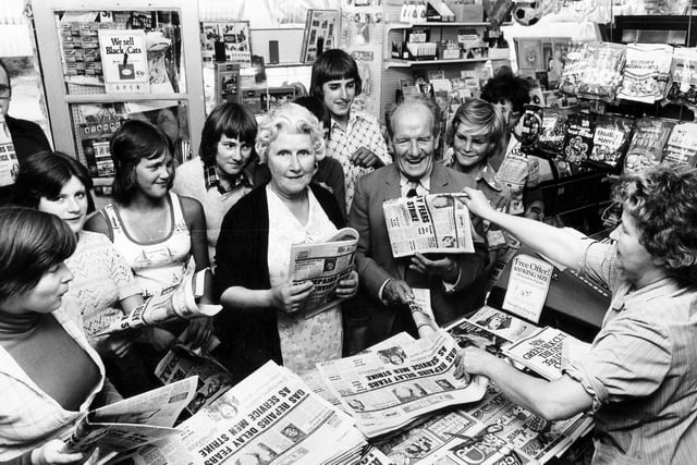 Customers buy their copy of The Star at this busy newsagents shop in Crookes, Sheffield, August 1976