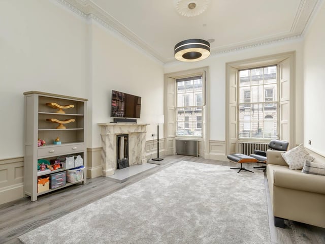 In the living room there is an integrated TV and ceiling speakers that are connected to a wireless Sonos system, with wireless boosters situated all throughout the house.
