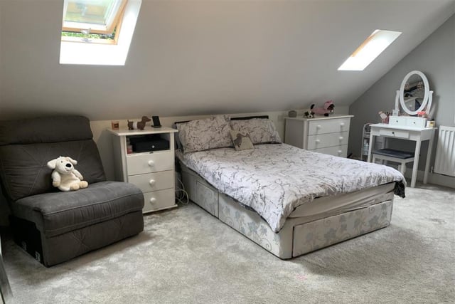 This third bedroom appeals even to the cuddly toy! It has a uPVC double-glazed window to the side, two Velux windows at the back and spotlights to the ceiling.