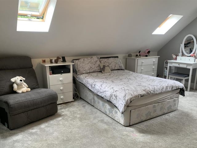 This third bedroom appeals even to the cuddly toy! It has a uPVC double-glazed window to the side, two Velux windows at the back and spotlights to the ceiling.