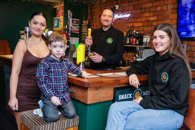 The Bulldog Value Bar on Chesterfield Road in Woodseats, Sheffield. Owner Danny Grayson pulls the first pint with wife Paulina, son Oscar, aged three, and Rhiannon Gibbs