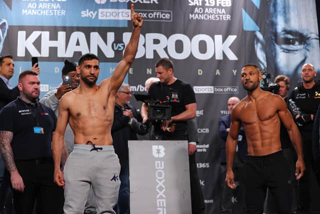 Amir Khan and Kell Brook pose towards their supporters during the official weigh-in at Manchester Central Convention Complex on February 18, 2022 in Manchester, England. (Photo by Alex Livesey/Getty Images)
