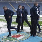 Blackburn Rovers manager Tony Mowbray (left) leaves the field following a second pitch inspection before the postponed Sky Bet Championship match against Millwall at Ewood Park. Richard Sellers/PA Wire.