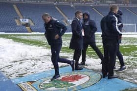Blackburn Rovers manager Tony Mowbray (left) leaves the field following a second pitch inspection before the postponed Sky Bet Championship match against Millwall at Ewood Park. Richard Sellers/PA Wire.