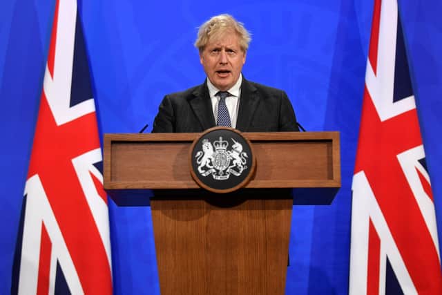 Britain's Prime Minister Boris Johnson (Photo by TOBY MELVILLE/POOL/AFP via Getty Images)