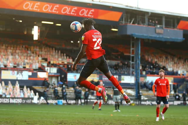 LUTON, ENGLAND - FEBRUARY 27: Elijah Adebayo of Luton Town scores their side's third goal during the Sky Bet Championship match between Luton Town and Sheffield Wednesday at Kenilworth Road on February 27, 2021 in Luton, England. Sporting stadiums around the UK remain under strict restrictions due to the Coronavirus Pandemic as Government social distancing laws prohibit fans inside venues resulting in games being played behind closed doors. (Photo by Julian Finney/Getty Images)
