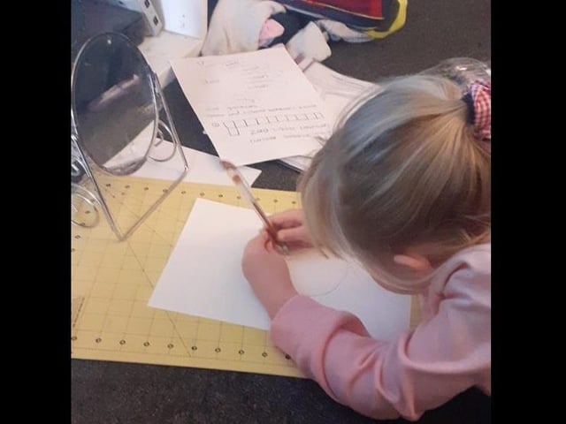 Selfies? Too easy. Rosenna Harley is working on her self-portrait with a mirror, a pen and paper.