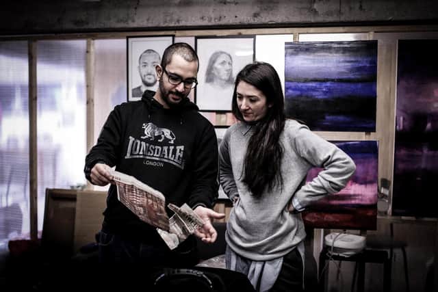 Artists Maria Marinou and Loukas Georgiou, preparing for their exhibition at Trippets Lounge Bar, Sheffield. Photo by Andy Muscroft