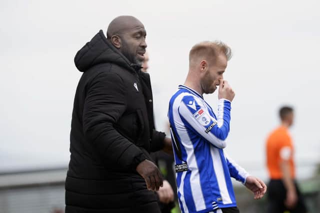 Sheffield Wednesday skipper Barry Bannan and boss Darren Moore at full time  after defeat to Forest Green Rovers. Pic Steve Ellis