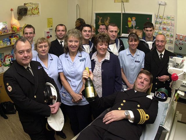 The Captain of HMS Sheffield, Commander Simon Williams, tries out the Fluoroscopy unit at the Children's Hospital as part of HMS Sheffield's fund raising efforts for the unit, on October 15, 2002