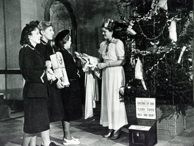 The Gaumont Cinema, Sheffield, and its Christmas Toy Appeal. Usherette Joyce Weldon collects for the appeal in 1947