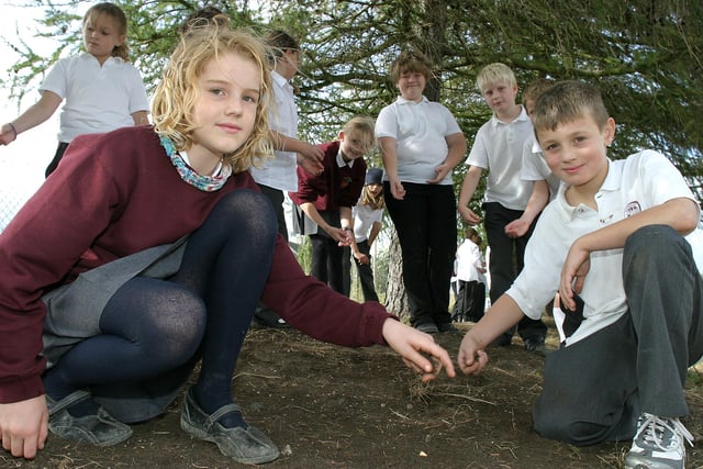 Lily Batford and Jordan Fletcher, front, with pupils from Bakewell Methodist Juniors School planting the new wild flower meadow in 2007.