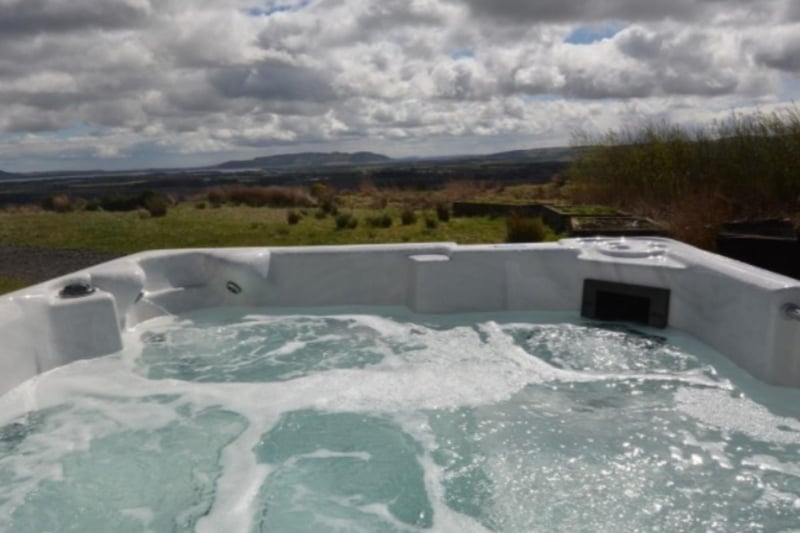 The hot tub has amazing views over the surrounding countryside.