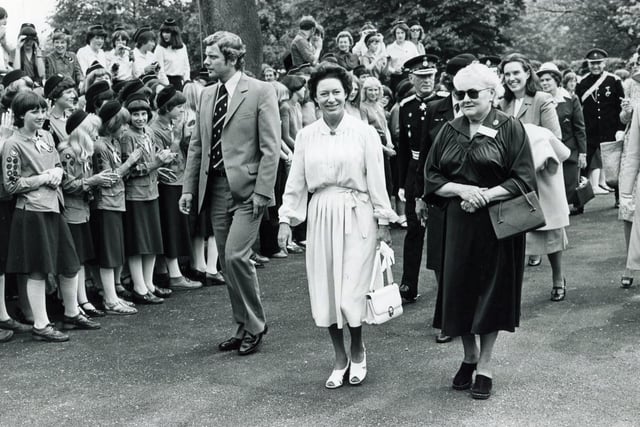 HRH Princess Margaret is escorted up the drive of Glenbrook, Bamford, the Guide Outdoor Activity Centre, by Lady Renwick (right), Chairman Glenbrook House Committee... to the waving of flags and cheering of Guides and Ranger Guides - 4th June 1980