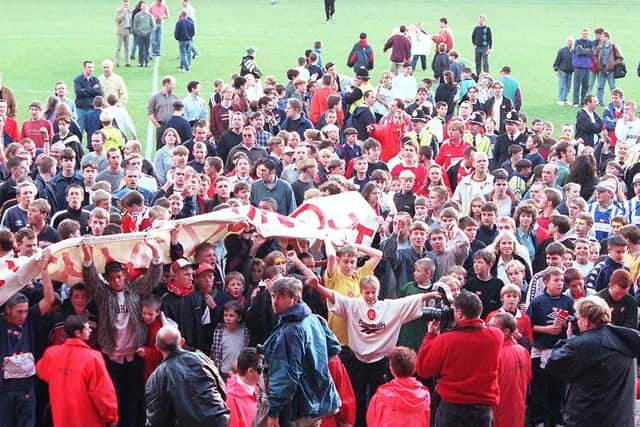 Angry fans invade the Belle Vue pitch calling for Richardson to go during the 1997-98 season.