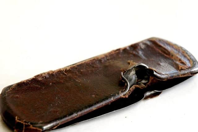The glasses case which took the sniper's bullet.
