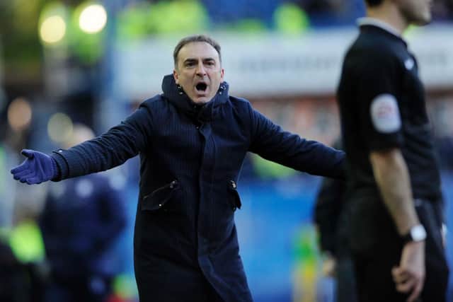 Carlos Carvalhal has a word with the assistant referee