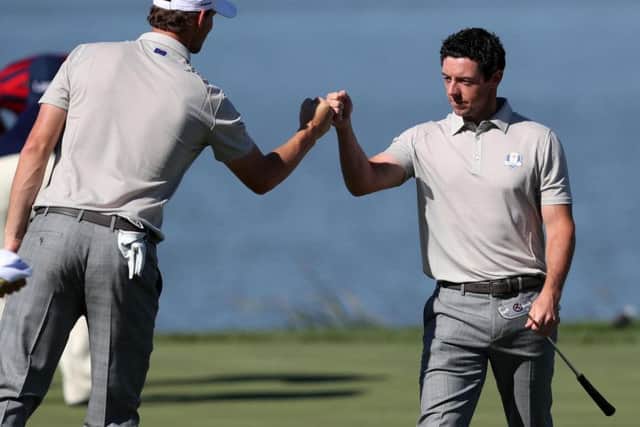 Europe's Rory McIlroy and Europe's Thomas Pieters celebrate on the 7th green during the Fourballs on day two of the 41st Ryder Cup at Hazeltine National Golf Club in Chaska, Minnesota, USA. PRESS ASSOCIATION Photo