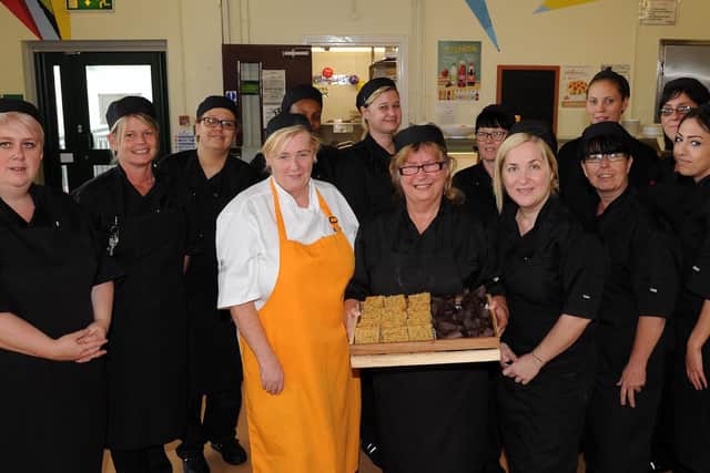 Barbara Renshaw is retiring as a pastry chef at Tapton School after 40 years, with the kitchen staff. Picture: Andrew Roe