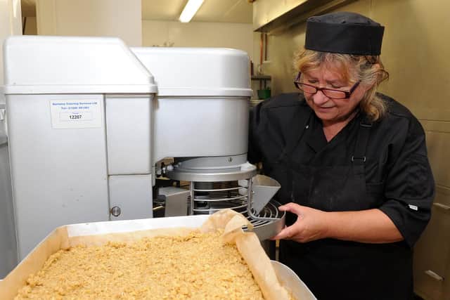 Barbara inspects the latest fresh batch of her delicious flapjack which is a staple favourite at the school