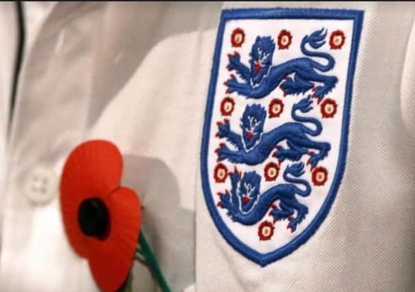 Poppy with Three Lions on our shirt