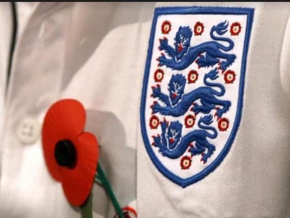 Poppy with Three Lions on our shirt