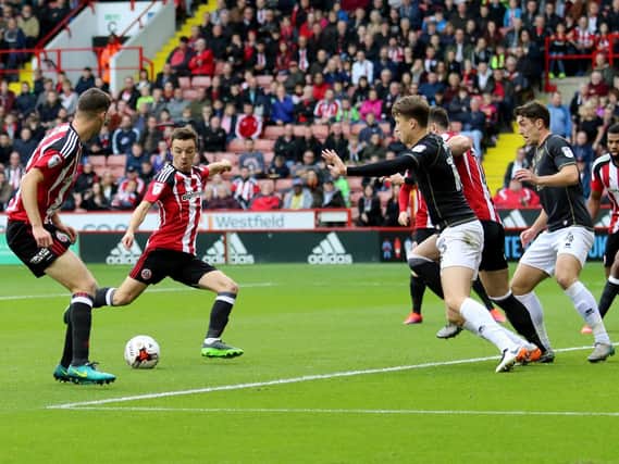 Stefan Scougall scoring against MK Dons on Saturday