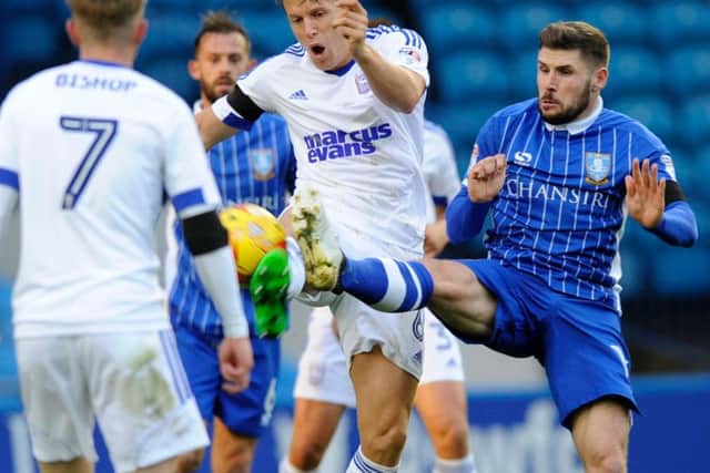 Gary Hooper finds himself crowded out in the Ipswich Town box