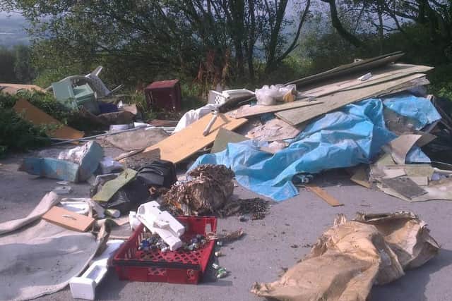 Fly-tipping in a car park in Loxley