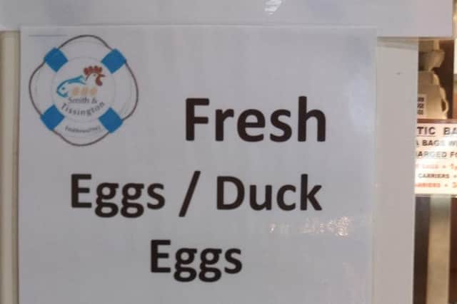 Duck eggs advertised in English and Chinese at Smith and Tissington, the Moor Market