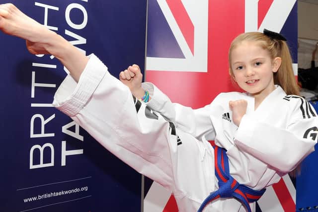 Caitlin poses at the Kangchul Blackbelt Academy in Rotherham