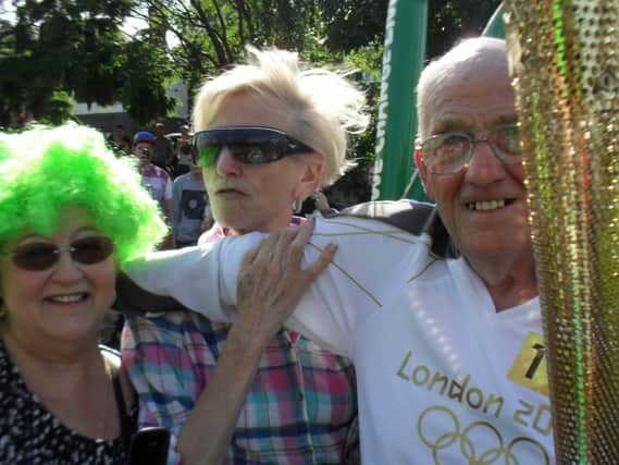 John on the Olympic torch bearers route in 2012