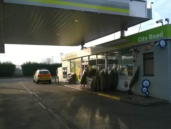 Police at the scene of the alleged armed robbery at City Road Service Station in Sheffield