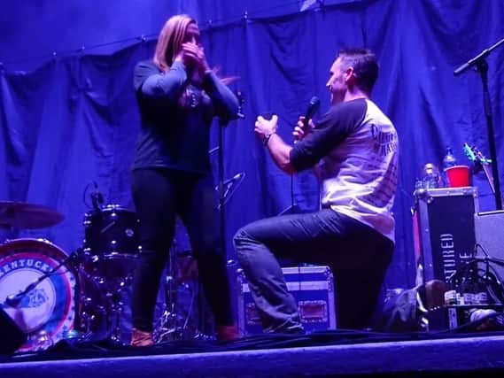 Kriss proposes to Clair on stage at Sheffield City Hall. (Photo: YouTube).