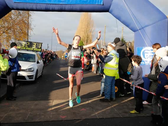 Eilish McColgan crosses the line in a new course record to win the Percy Pud 10k
