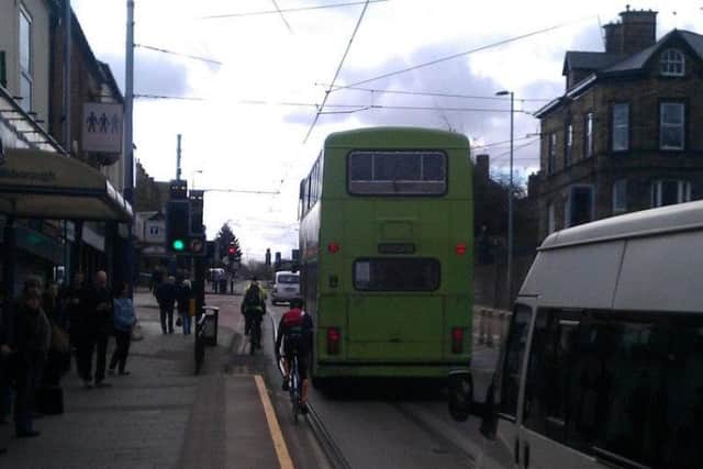 A cyclist on the tram route in Hillsborough