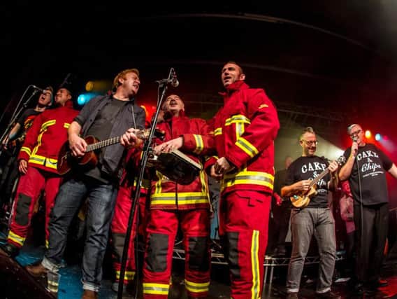 Sheffield firefighters join The Everly Pregnant Brothers on stage as the band performs Chip Pan