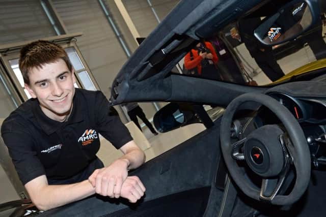 Ian Hutchinson with one of the McLaren supercars he will be helping to manufacture