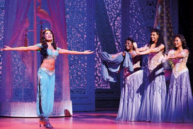 Disney princess Jasmine, played by Jade Ewen, with Aladdin performers in the hit West End show. Photo: Deen van Meer  Disney