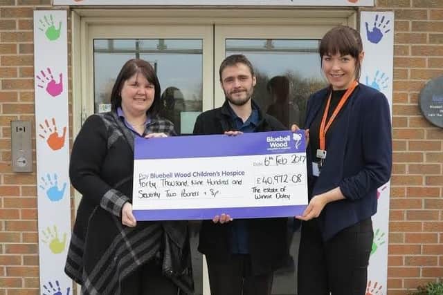 Sonia Williams and Andrew Bramhald from Nightingale Care Home with Julie Booth from Bluebell Wood Childrens Hospice