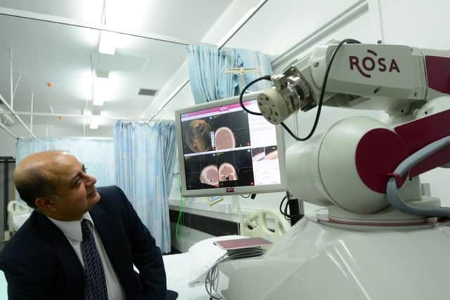 The ROSA surgical assistant robot could transform the lives of thousands of people needing complex brain surgery. Pictured is Sheffield consultant neurosurgeon Dev Bhattacharyya. Picture: Scott Merrylees/The Star