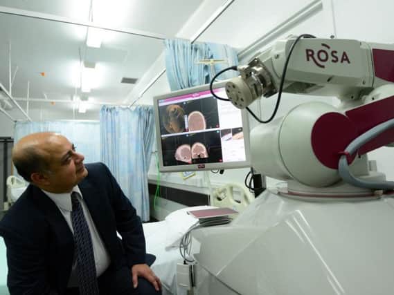 The ROSA surgical assistant robot could transform the lives of thousands of people needing complex brain surgery. Pictured is Sheffield consultant neurosurgeon Dev Bhattacharyya. Picture: Scott Merrylees/The Star