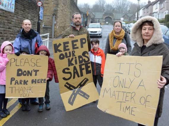 Parents protest against drivers parking dangerously outside Carfield Primary School