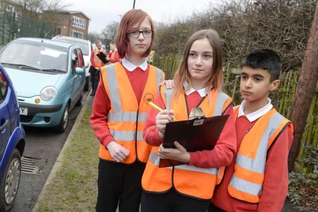 Pupils monitor parking outside Athelstan Primary School