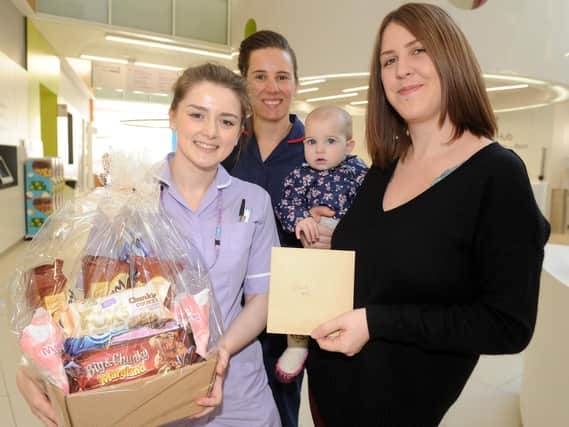 Sarah Birch (right) and daughter Annie present gifts to Sheffield Children's Hospital staff Jo Reid-Roberts and Emma Harding to say thanks for their care (Andrew Roe)