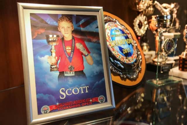 Some of Scott Marsden's impressive haul of kickboxing trophies (SWNS)