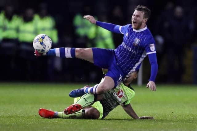 Sam Winnall is scythed down by Reading's Liam Moore